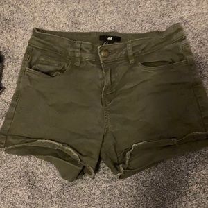 Green frayed shorts